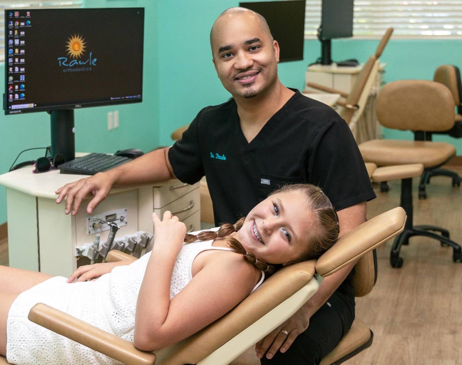 Smiling patient and orthodontist at Rawle Orthodontics in Lake Mary, FL.